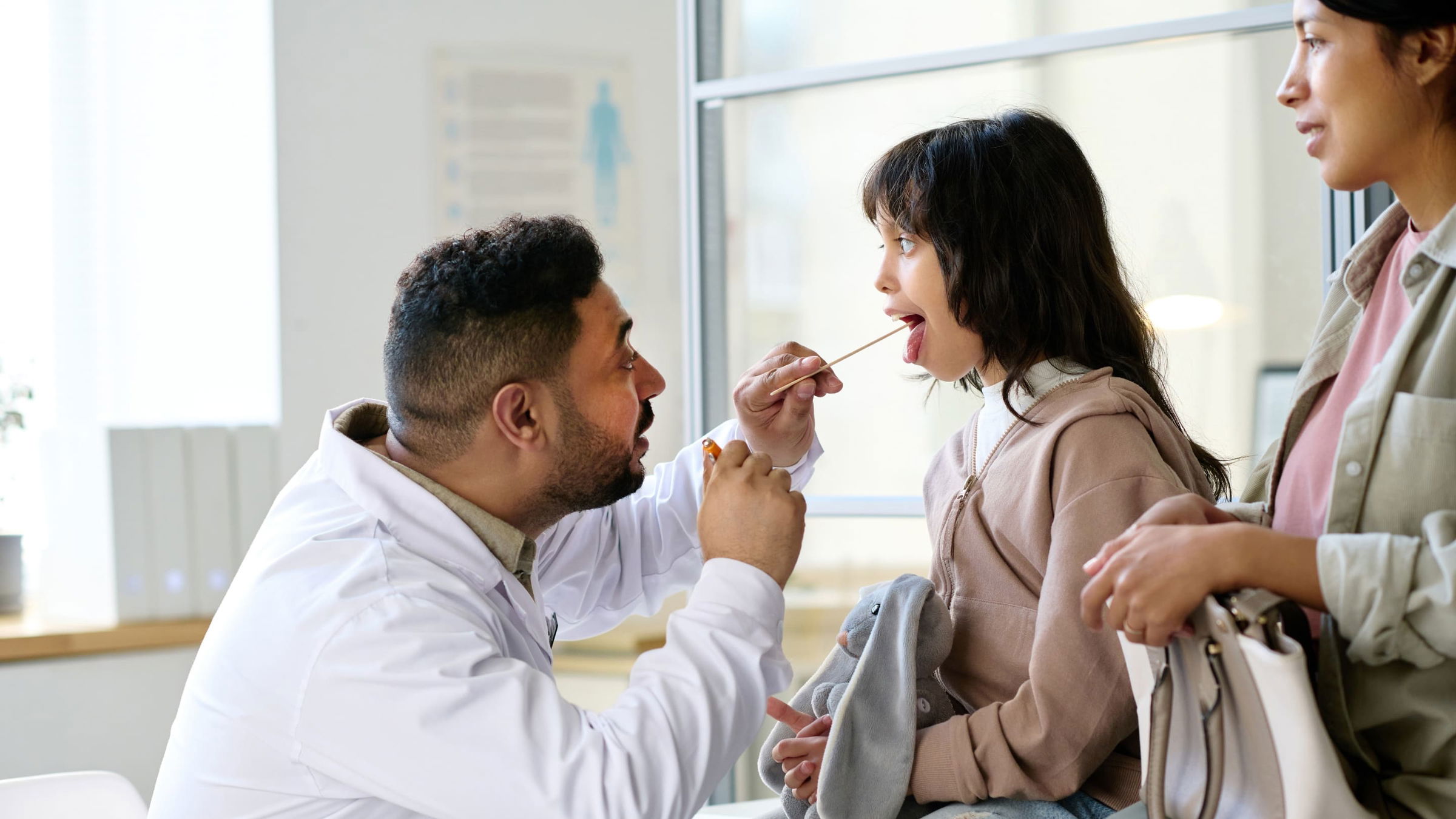 A young girl gets an examination at the doctor.
