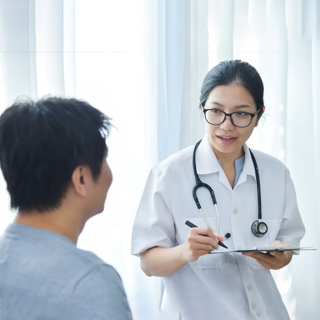 A doctor is checking a little girl's ear.