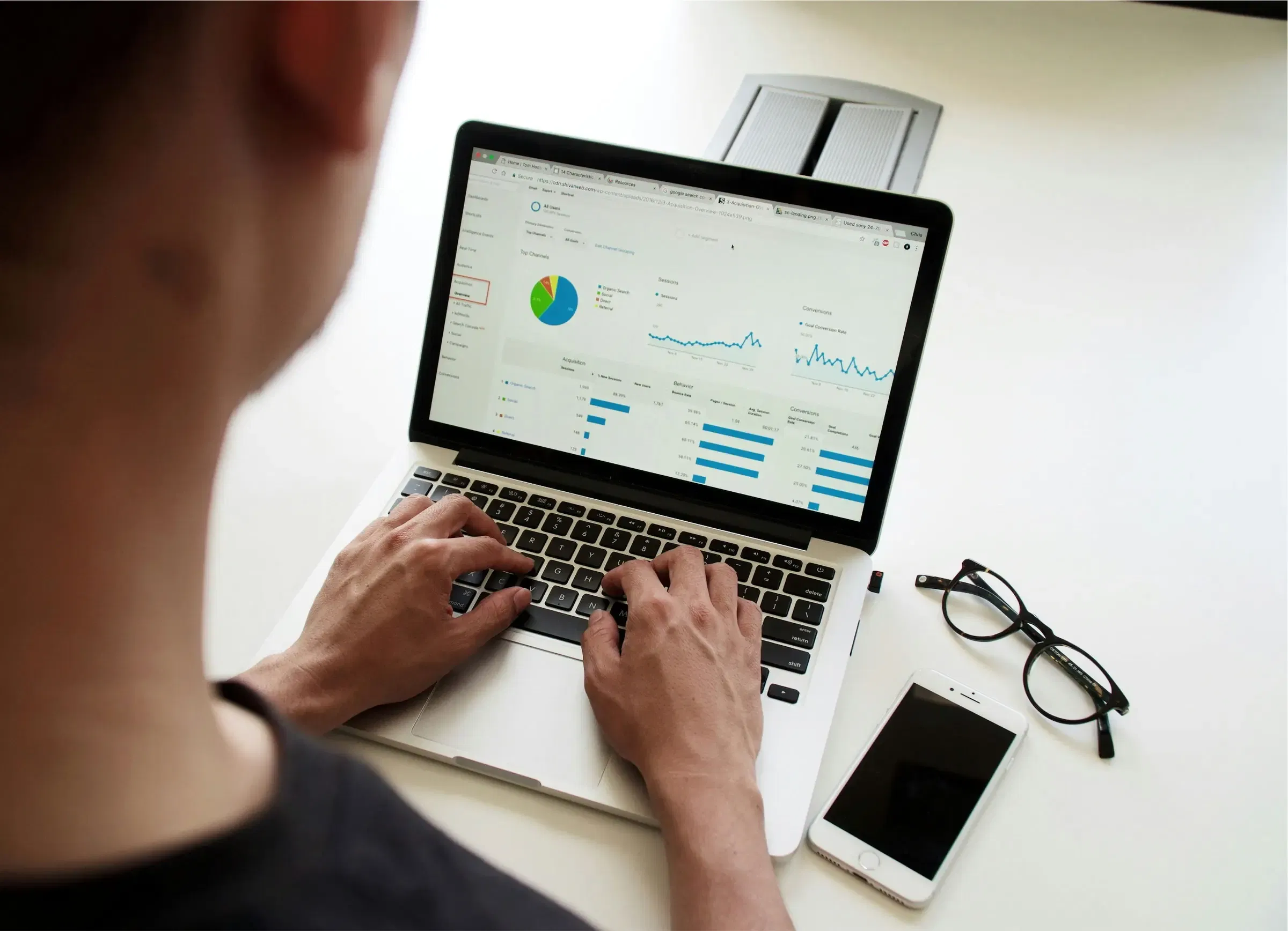 Person reviewing data on laptop screen