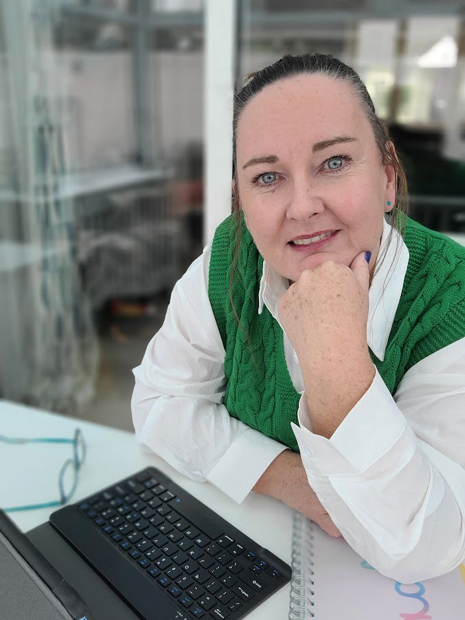 Jen from WordCraft by Jen working on client copy at her laptop at home