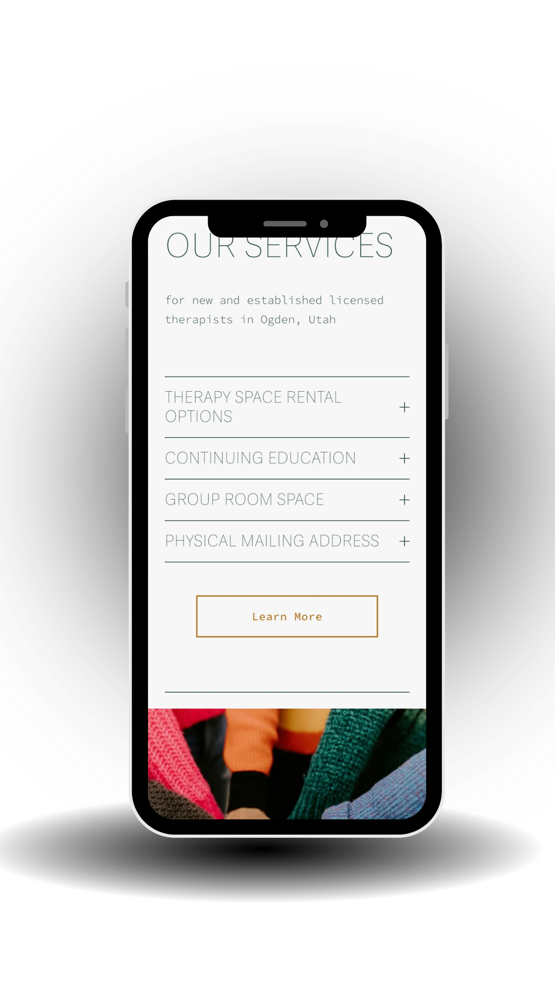 Digital mockup of Ogden therapy cooperative's website displayed on a sleek black tablet with a transparent background,
