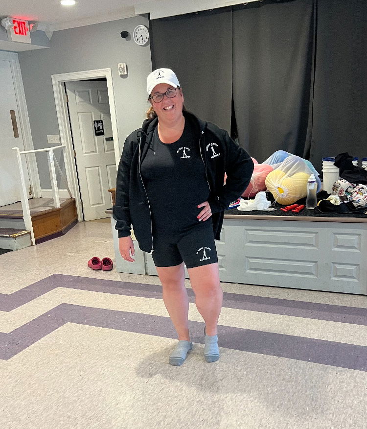 Dance aerobics student wearing black sweatshirt