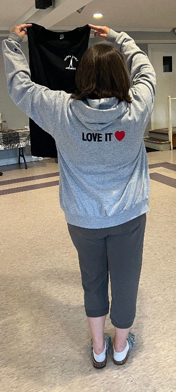 Dance aerobics student wearing gray sweatshirt