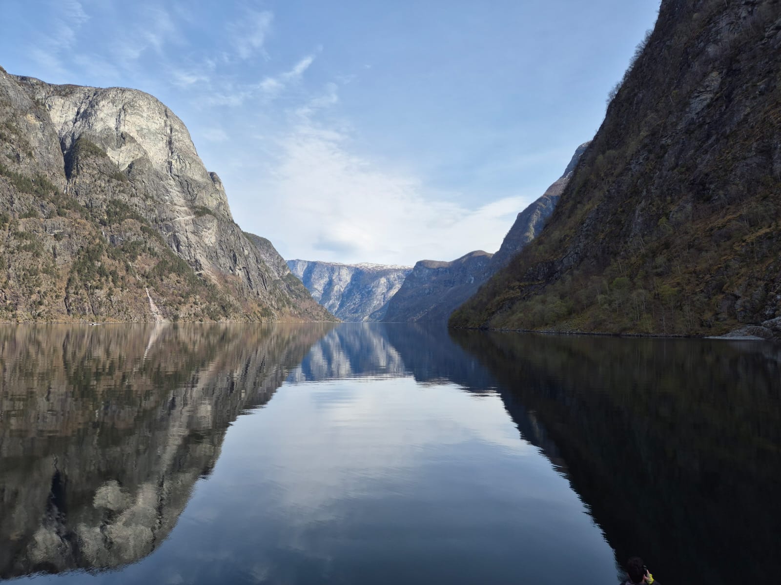 Mountains reflecting into the fjord