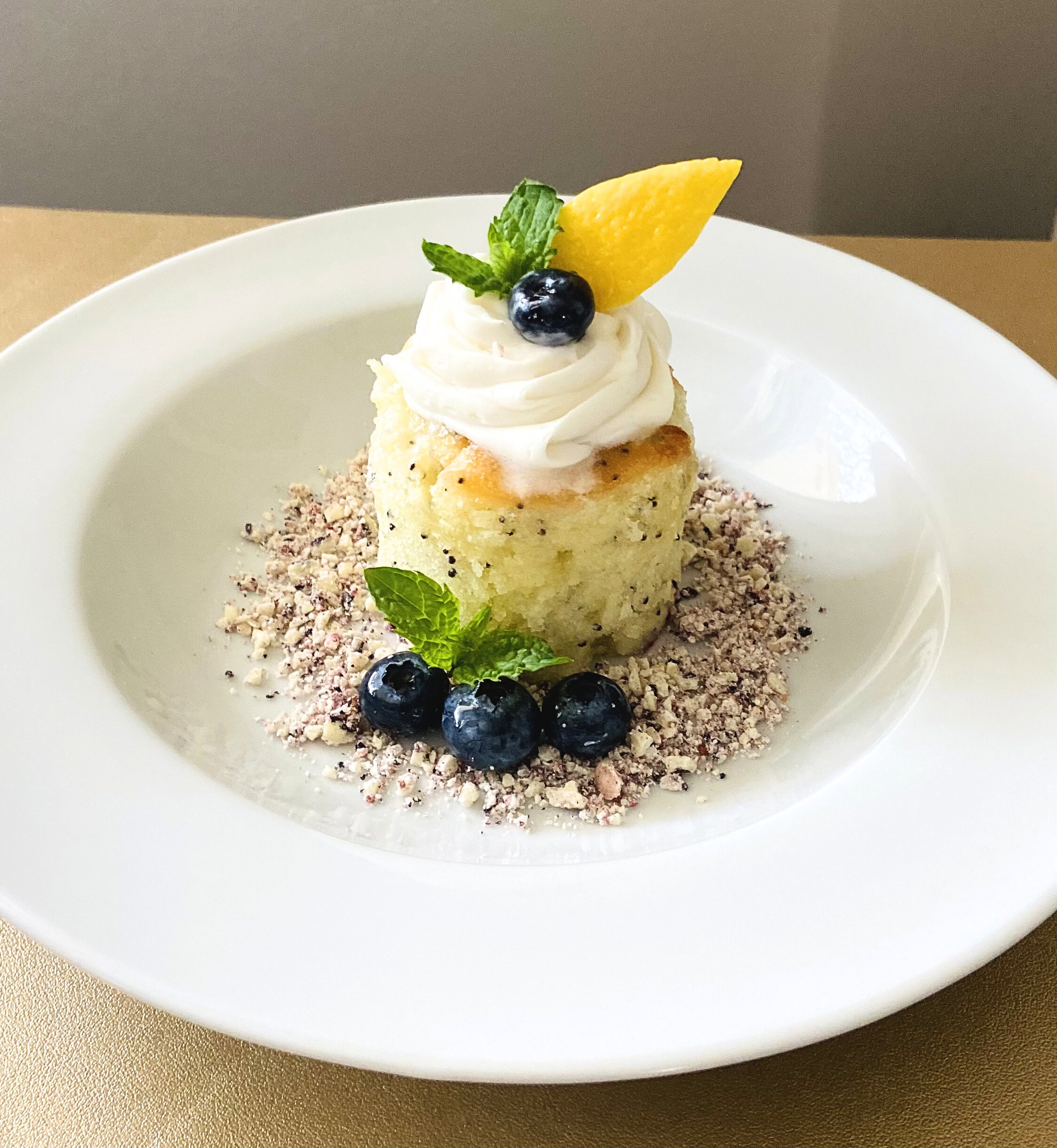 Charcuterie platter and glass of red wine set on a private jet cabin table.