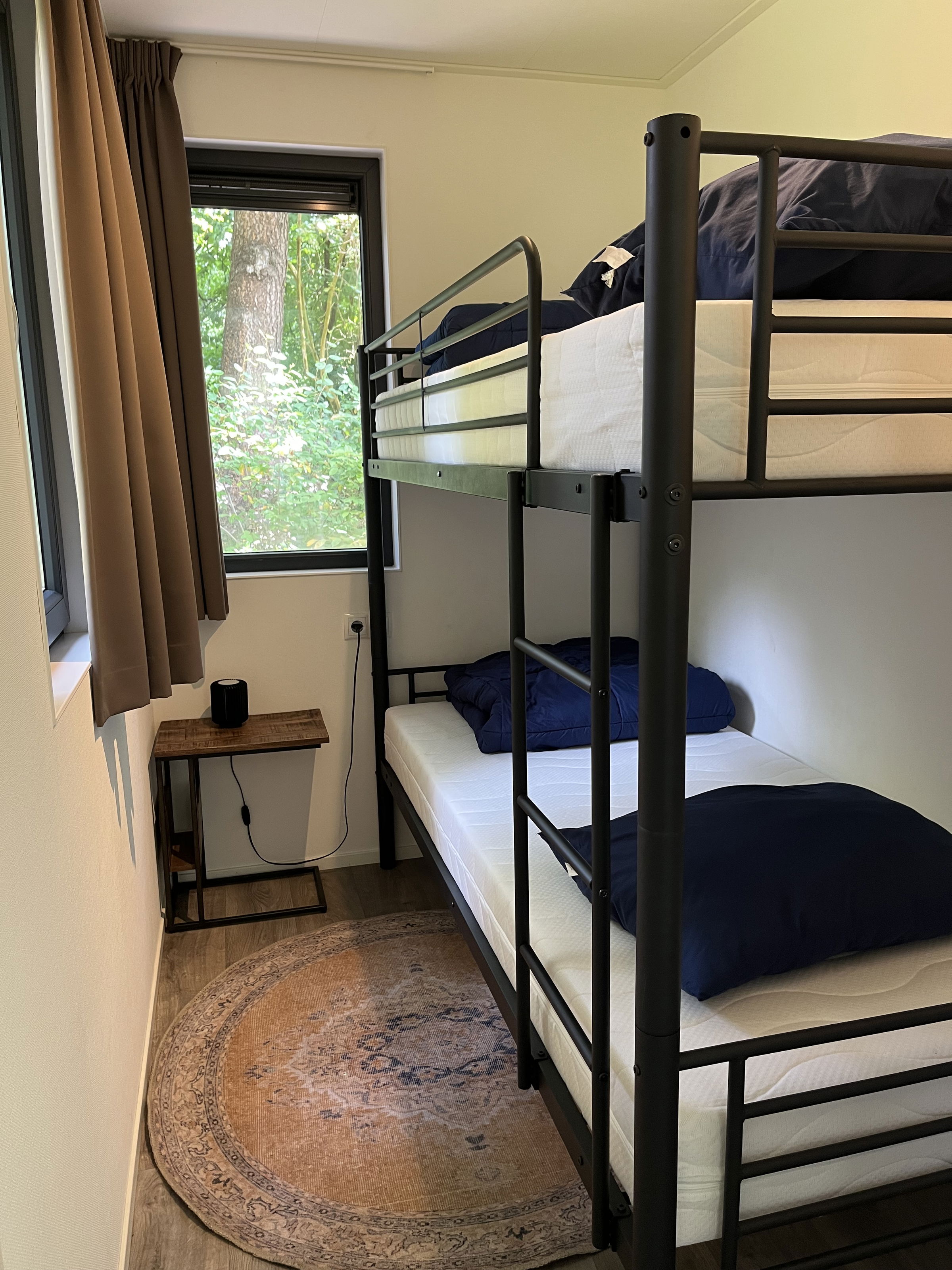 Kids’ bedroom with cozy bunk bed featuring M Line mattresses and playful details