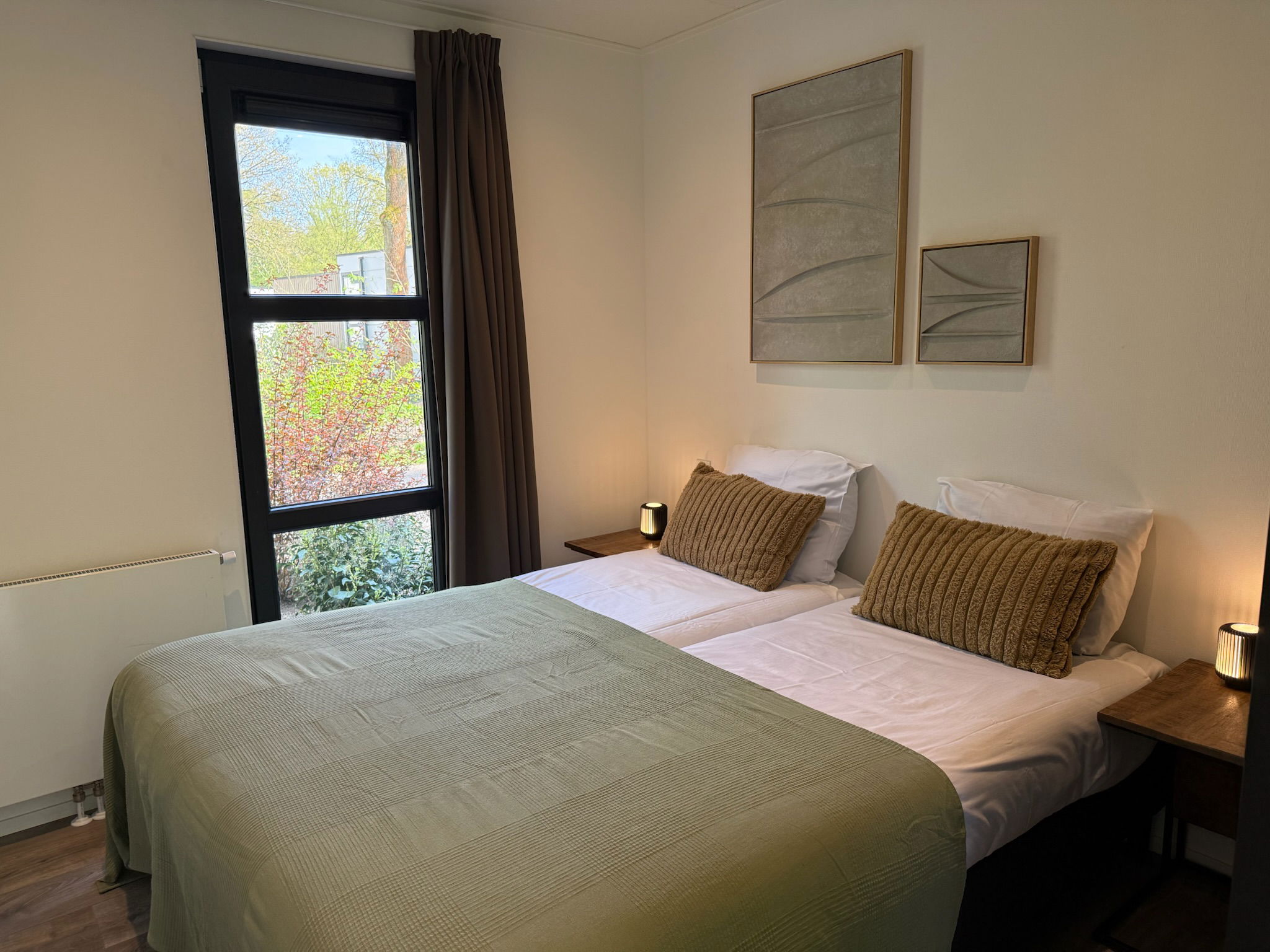 Comfortable second bedroom with two single M Line mattresses and calm natural tones