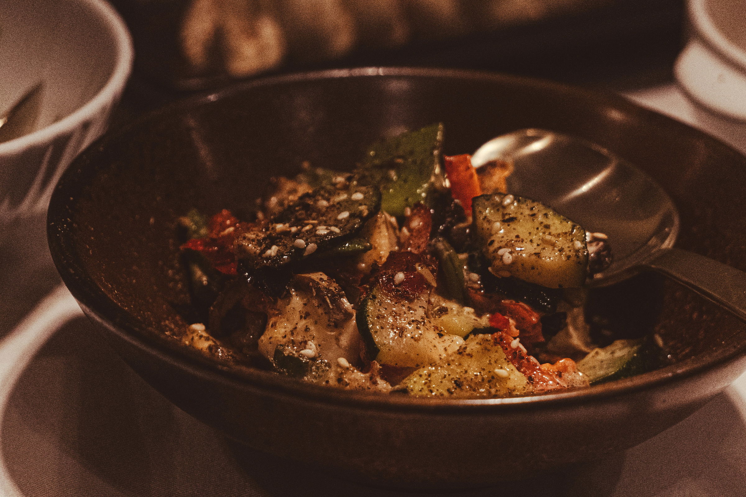 African American man seasoning steak with smoked salt