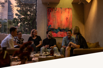 A group chatting in Saigon during the Cocktail Experience