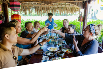 A group cheering on the Modern Culinary Experience in Hoi An