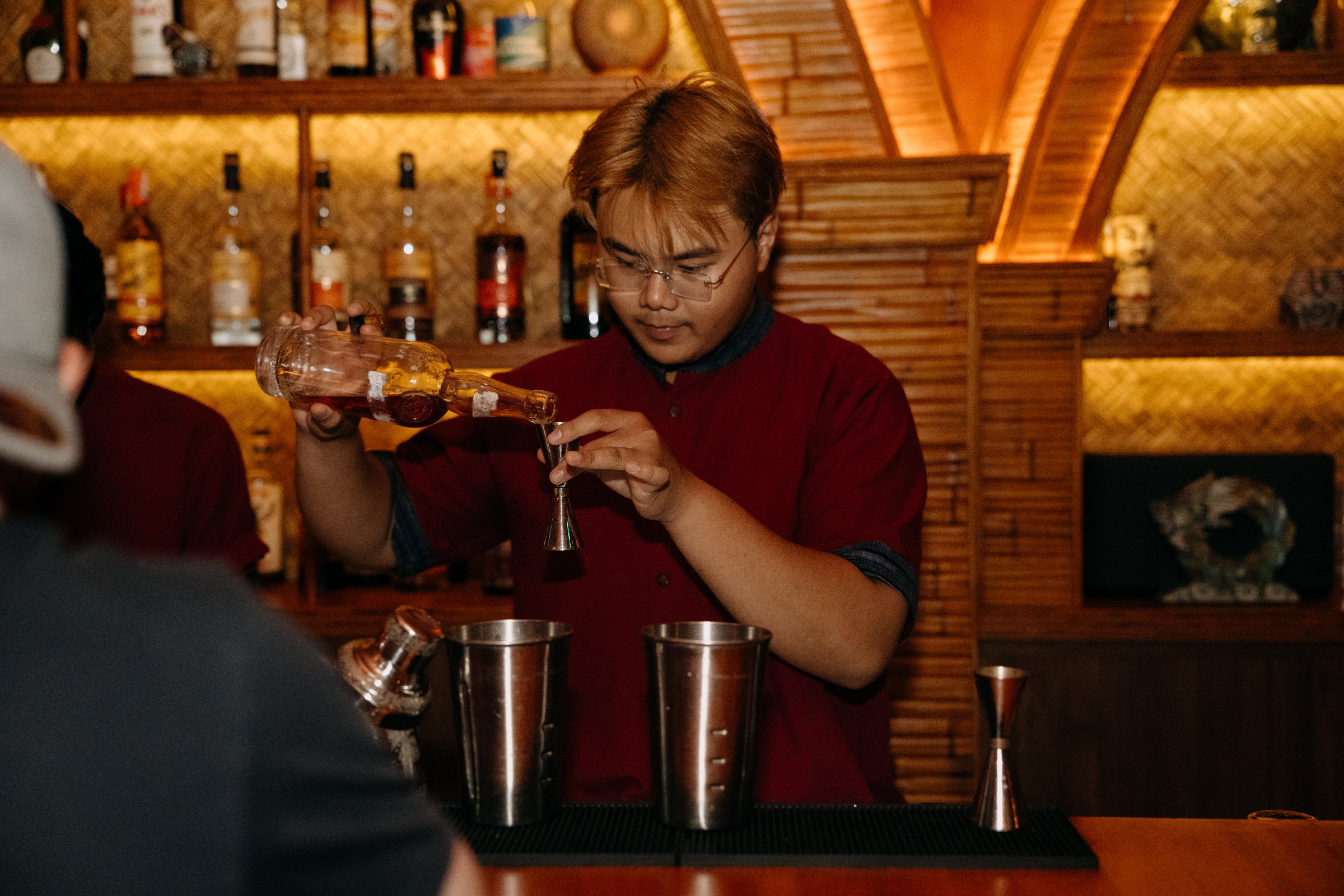 A mixologist making a cocktail 