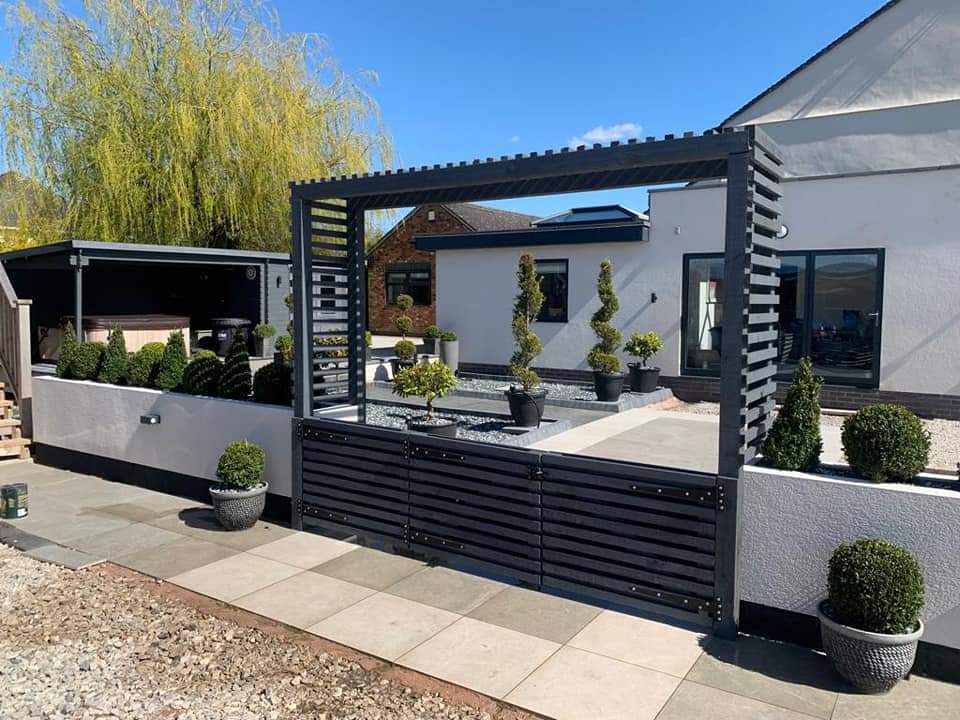 Custom made contemporary gates with a stylish surround to provide a grand entrance