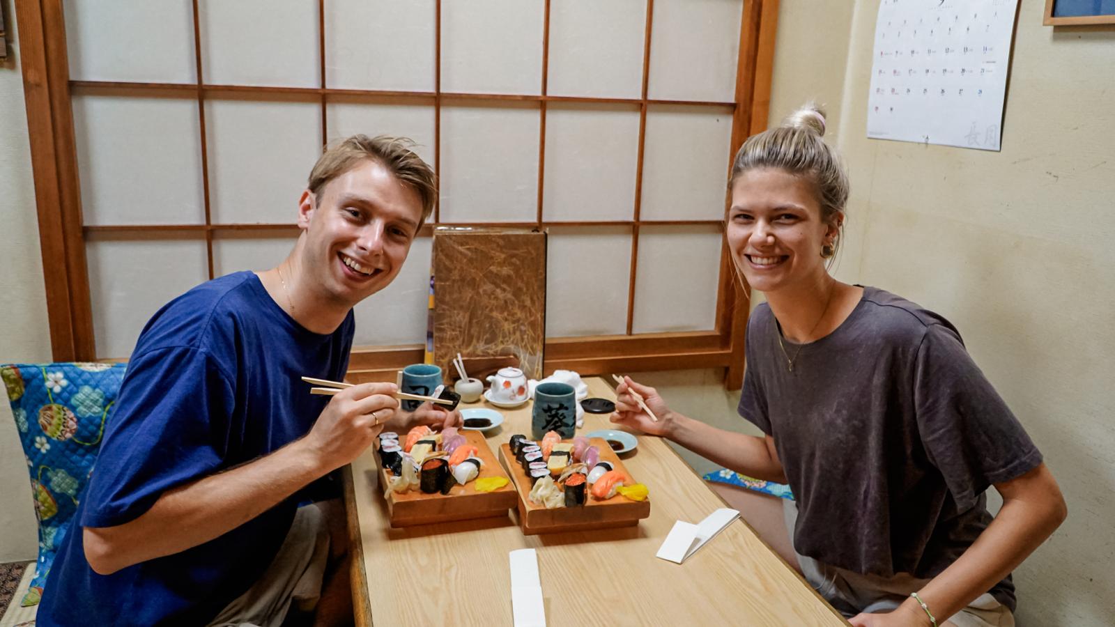 The founders of Warsaw Like a Local enjoying a shared meal during travel