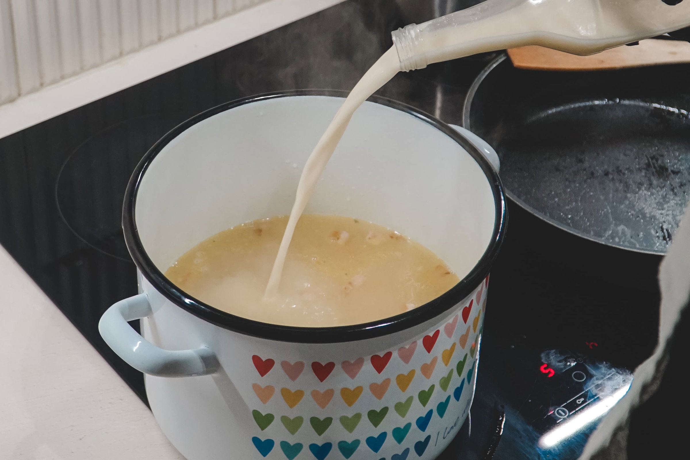 Guests learn to cook a traditional Polish soup zurek together in a Warsaw home kitchen