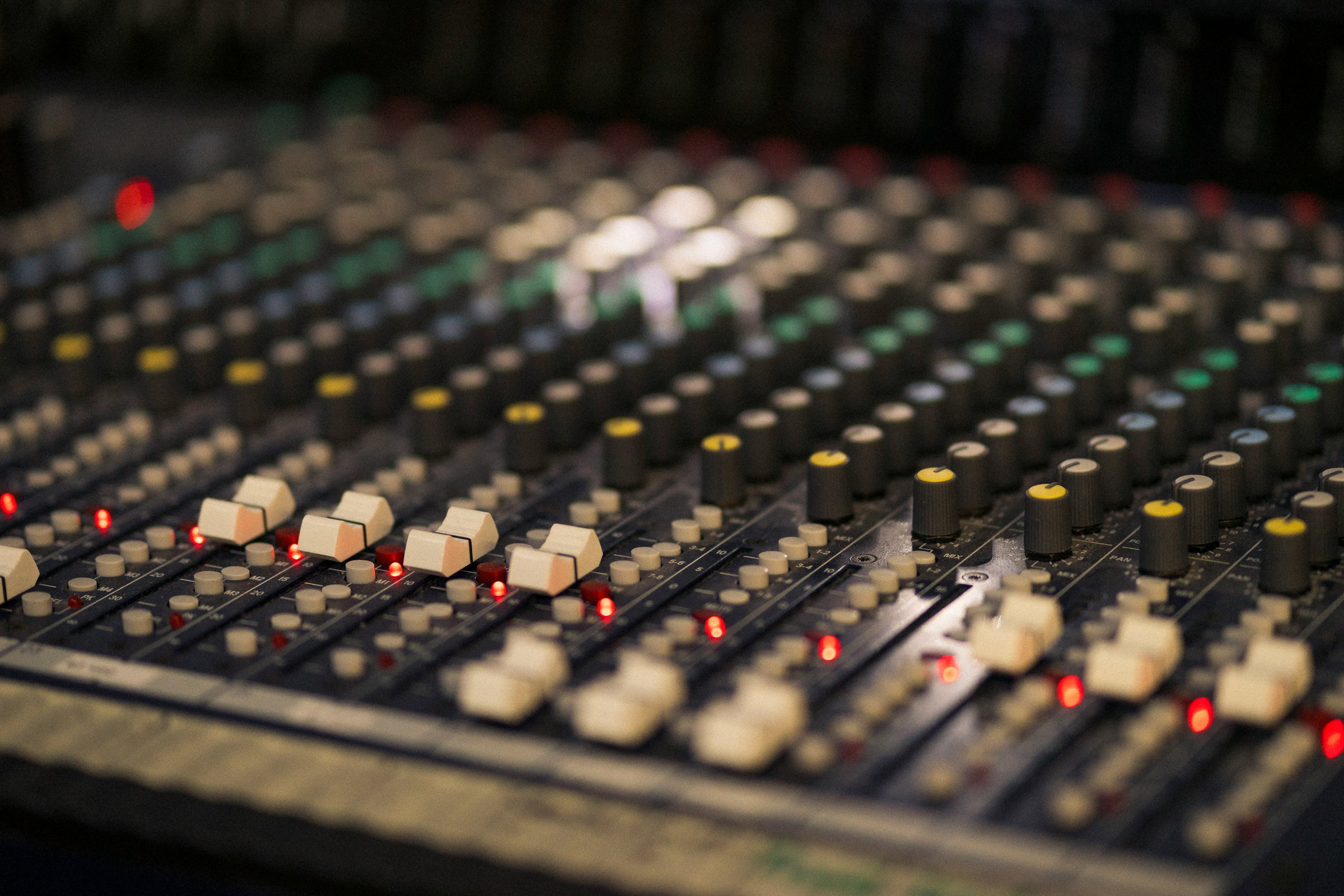 Professional podcast recording booth with industry-standard microphones and isolation panels
